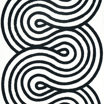 Black-on-white abstract rug with thick looping wavy lines forming a labyrinth pattern; modern decor.
