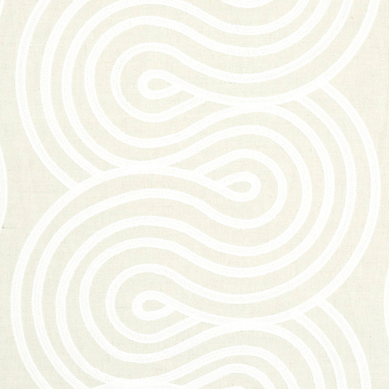 Cream fabric with bold white looping embroidery motif; soft textile for modern decor.