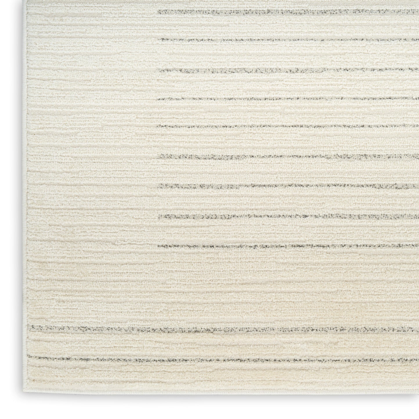 Cream ribbed woven rug with subtle beige horizontal stripes; rectangular, cozy home decor.