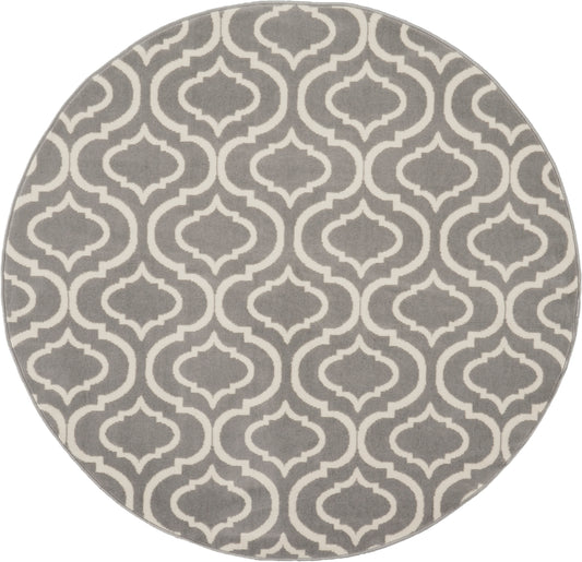 Round grey rug with white Moroccan trellis pattern; soft textile floor decor.