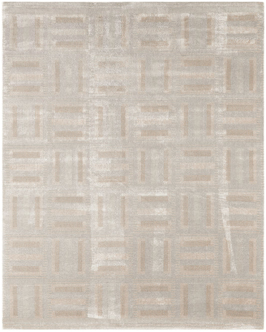 Rectangular beige woven area rug with taupe and ivory geometric block pattern; modern neutral decor.
