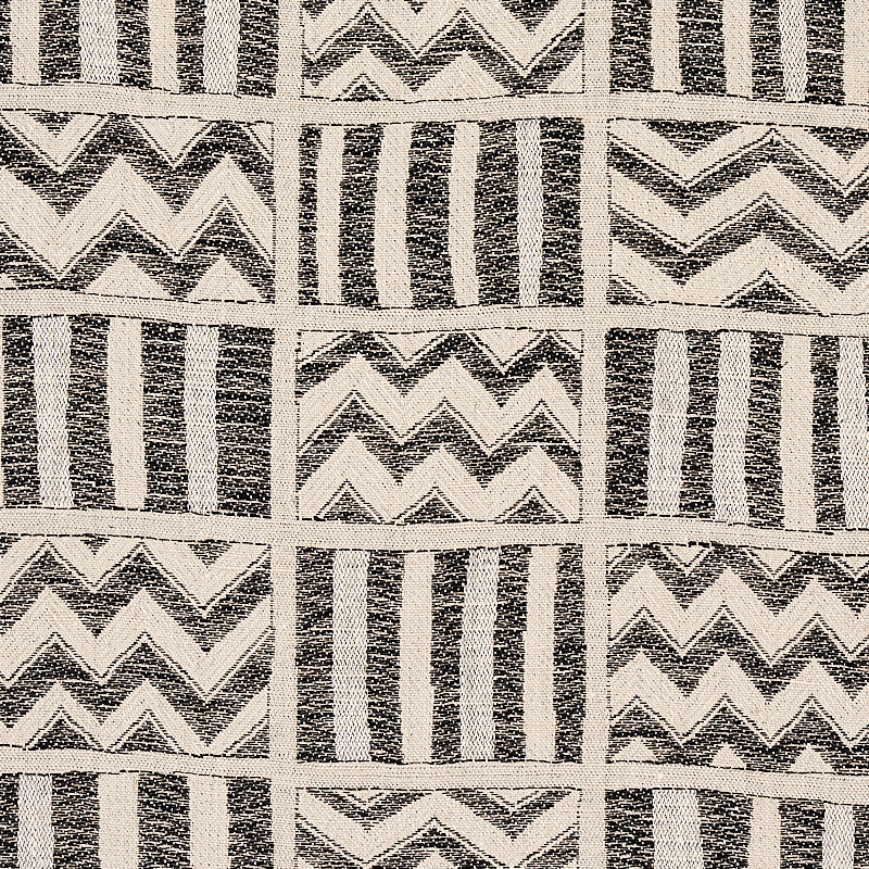 Monochrome fabric pattern in a grid of squares featuring vertical stripes and zigzag chevrons in black on cream.