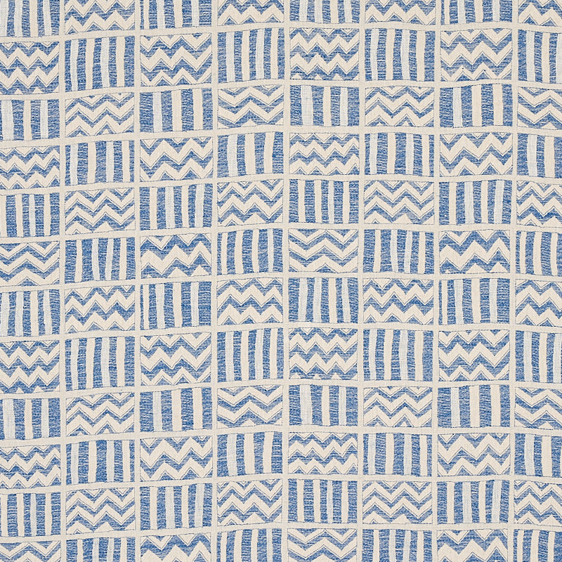 Blue and ivory woven textile with small square blocks featuring vertical stripes or chevrons, quilt-like pattern.