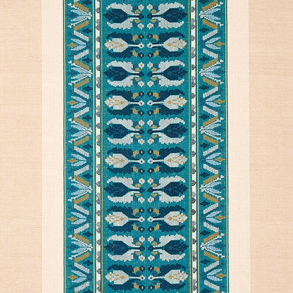 Teal and turquoise patterned runner rug, narrow vertical strip with white floral motifs and turquoise borders on beige.