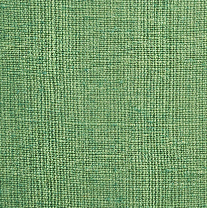 Close-up of lime-green woven fabric texture, suitable for upholstery or craft projects.