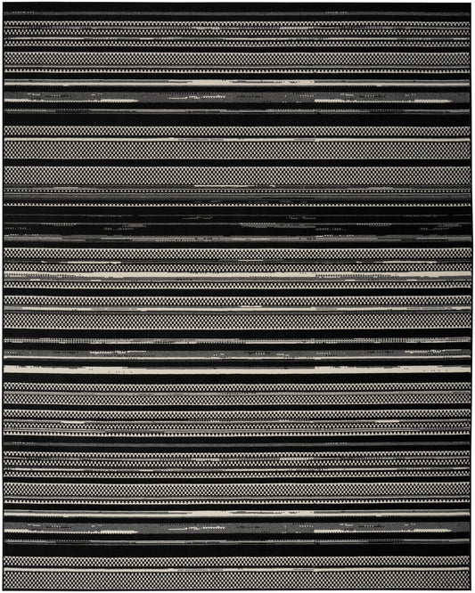 Woven black and white striped rug with alternating solid, checkered and textured bands.