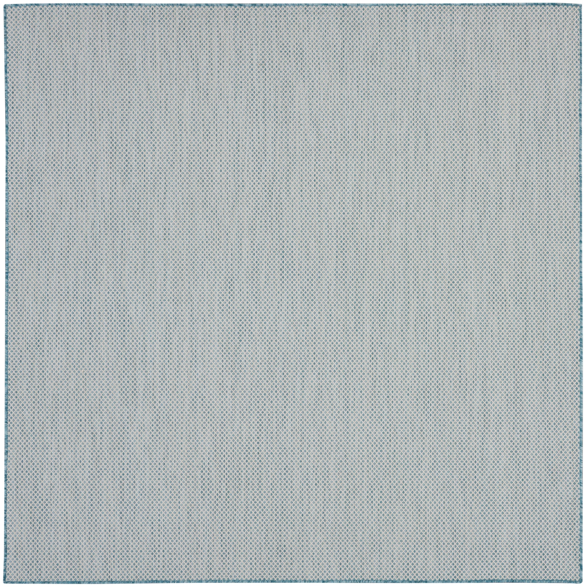 Light gray-blue rug with a tiny blue dot pattern and a stitched border.