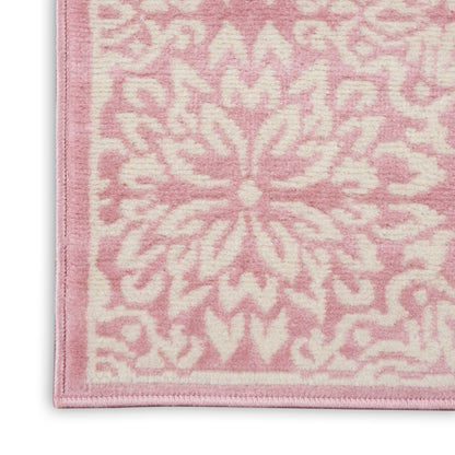 Soft pink runner rug with pale pink floral medallion motif and bound edge; decorative for living spaces.