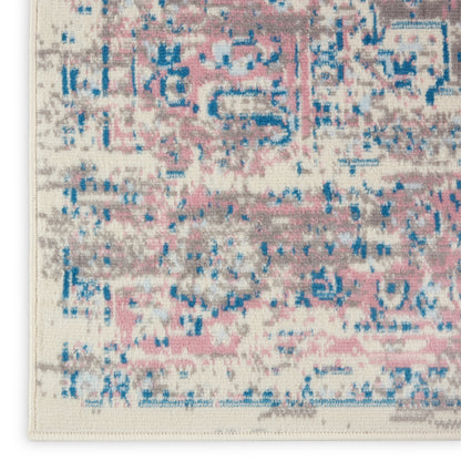 Distressed abstract area rug in pink, blue & gray on cream ground with fringe edge; modern vintage style.