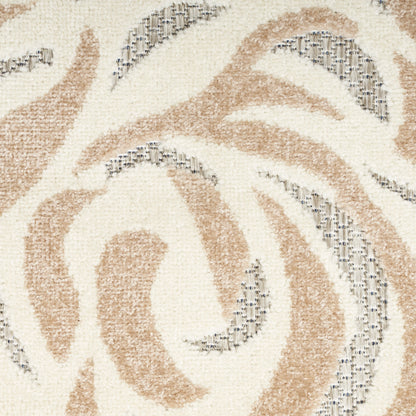 Close-up of a woven rug with cream background and tan swirls, gray accents, soft textured pile.