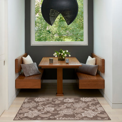 Wood corner dining nook with square table, L-shaped benches, grey cushions, vase of white flowers, dark wall, black pendant.