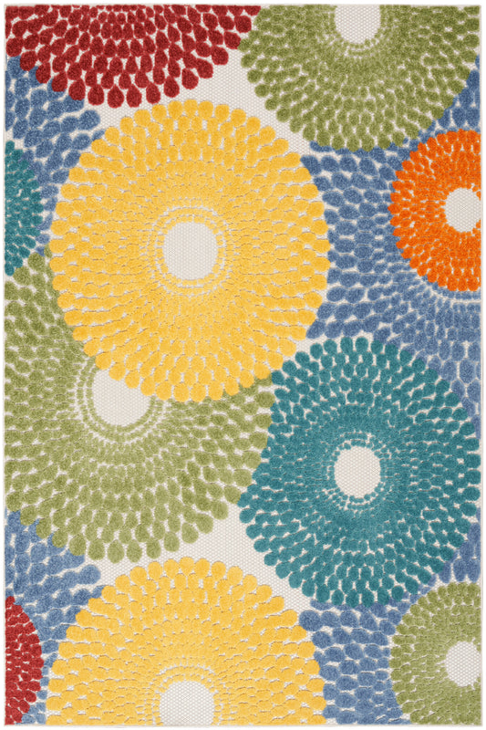 Colorful circular tufted rug with yellow, teal, red, orange and green rosettes on beige background; shaggy texture.