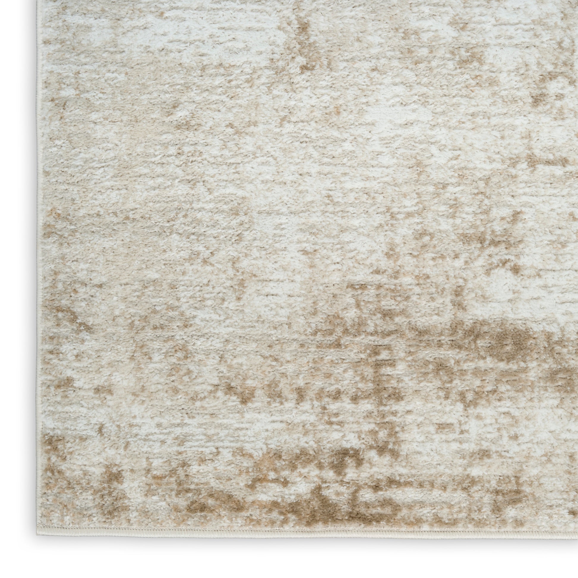 Beige cream abstract textured rug with distressed tan pattern; plush, versatile living room decor.