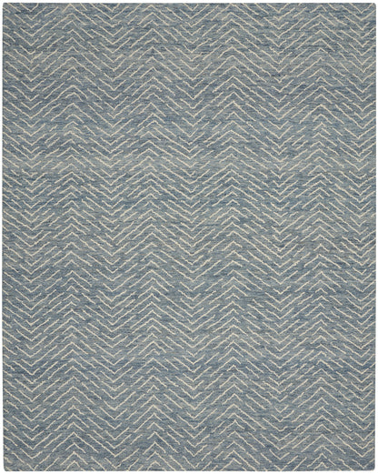 Blue-gray rug with ivory chevron zigzag pattern and soft woven texture; modern geometric decor.