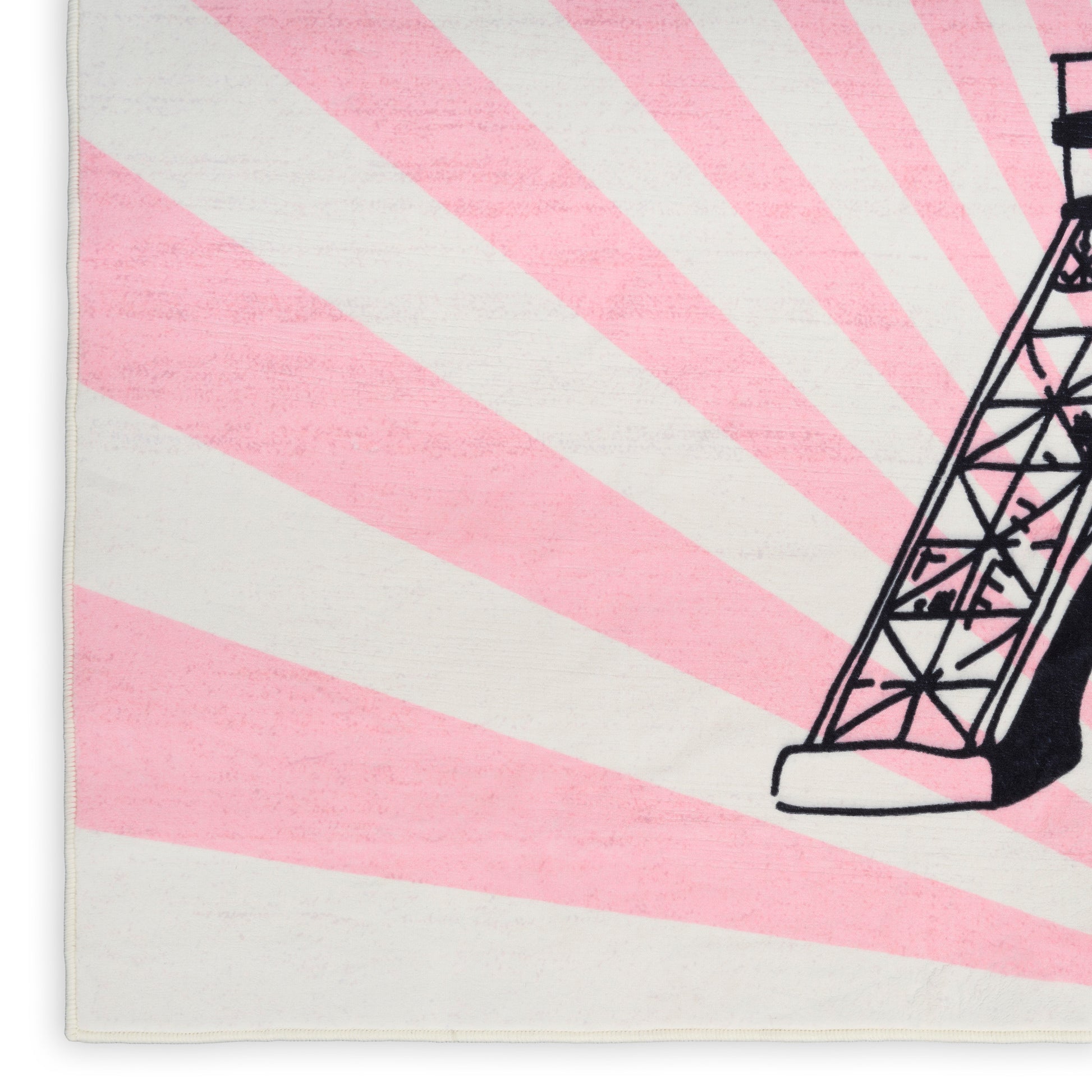 Pink and white sunburst rug with a black lattice tower design.
