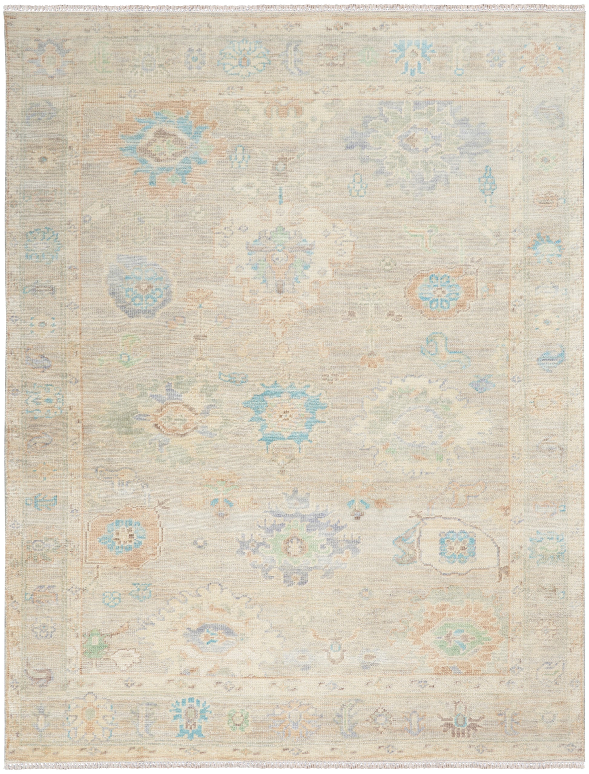 Pastel beige oriental area rug with faded blue, teal and peach floral medallions and soft bordered frame.