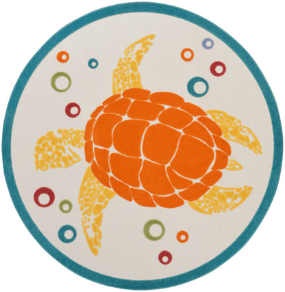 Round rug with teal border, bright orange turtle central motif and multicolored rings on a neutral background.
