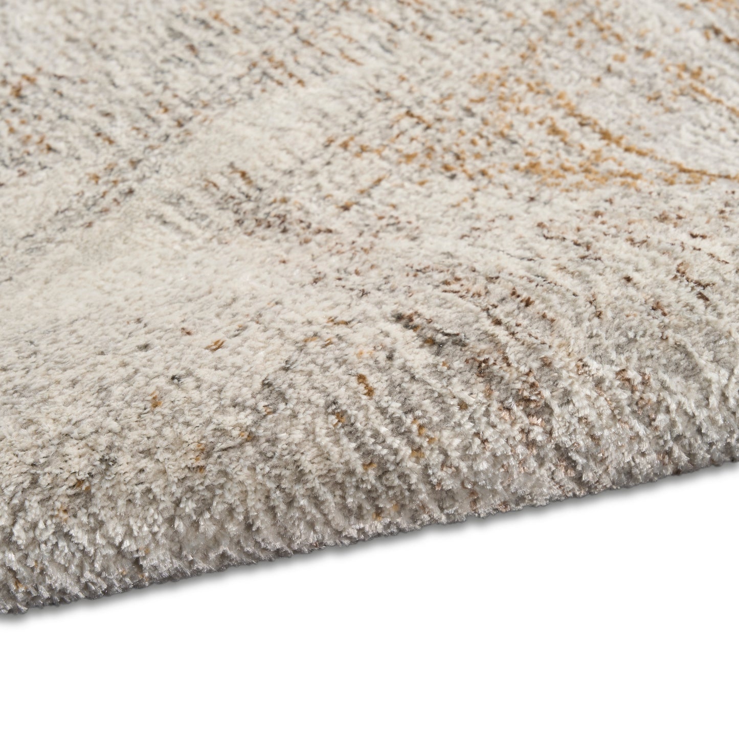 Cream-beige shag rug with soft, high-pile plush fibers and textured surface.