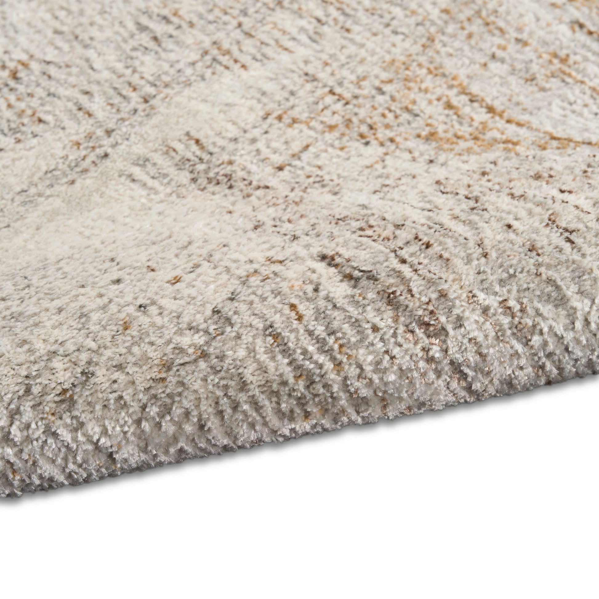 Cream-beige shag rug with soft, high-pile plush fibers and textured surface.