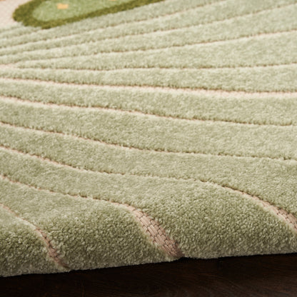 Cream shag rug with plush pile and subtle pink-beige curved lines; close-up shows soft texture on dark wood floor.