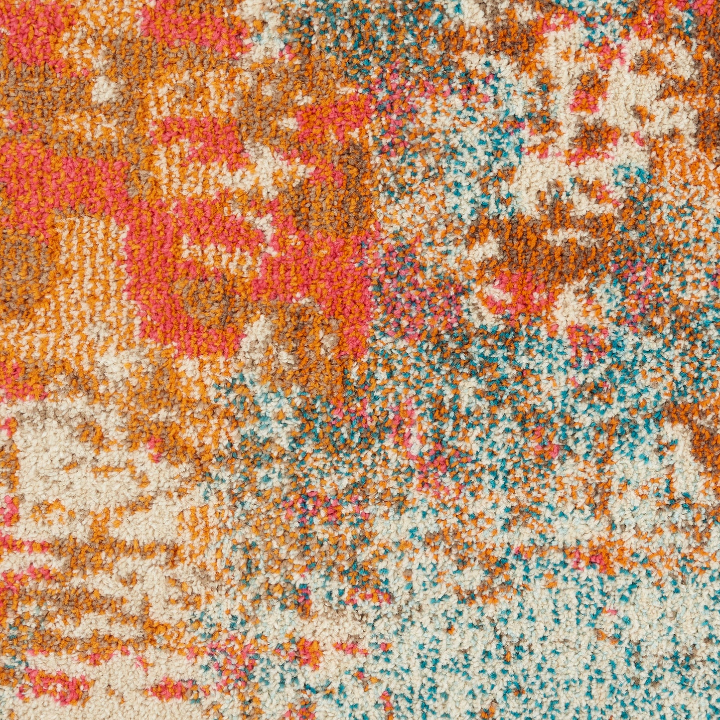Shaggy rug with a vibrant abstract pattern in orange, pink, cream, teal & blue hues; plush, textured pile.