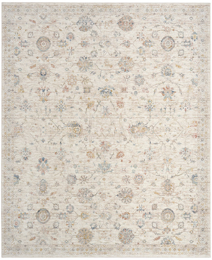 Cream vintage-style area rug with faded floral medallions in pale blue, taupe and gray; rectangular.