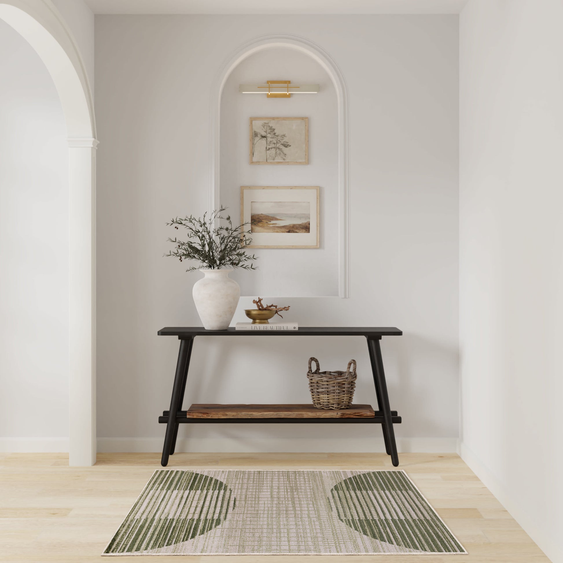 Green rug in a living room scene with a dark wooden console table, vase with branches, framed art, and a wicker basket.