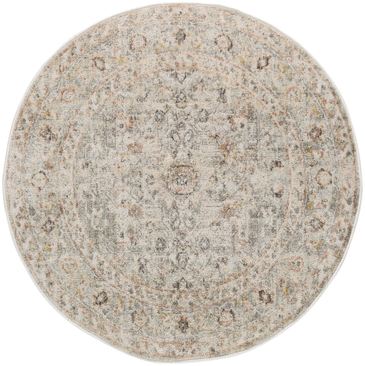 Round distressed oriental rug in beige-gray palette with soft pile and subtle peach accents.