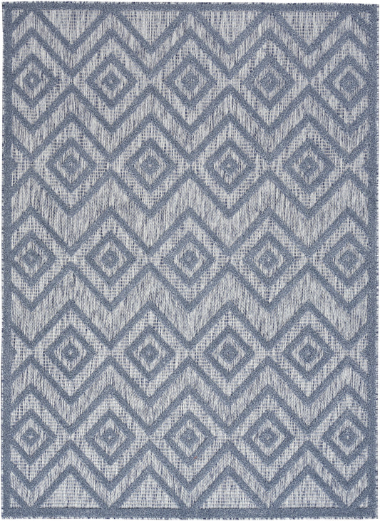 Blue-gray woven rug featuring a repeating diamond lattice pattern with a dark border.