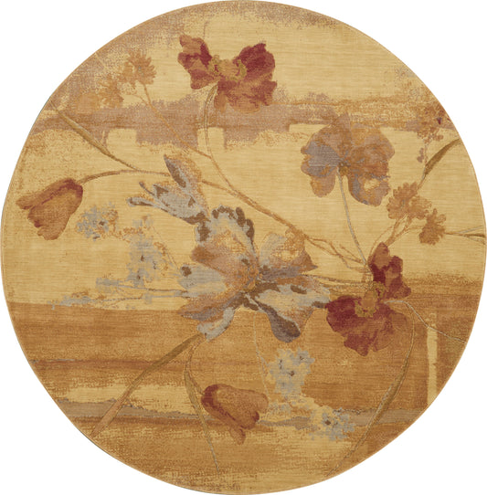 Round rug with warm golden beige background and faded blue, burgundy, and brown floral vines.
