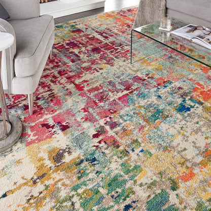 Abstract multicolor plush area rug with cream base; pink, teal, yellow & blue tones for modern living rooms.