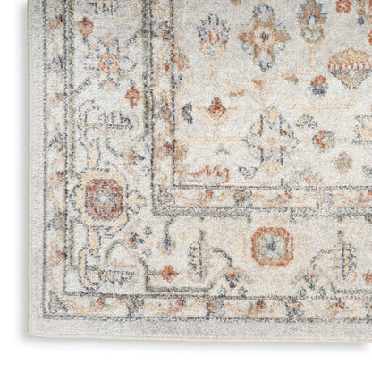Beige oriental area rug with blue-gray and rust motifs, ornate border and soft plush pile.