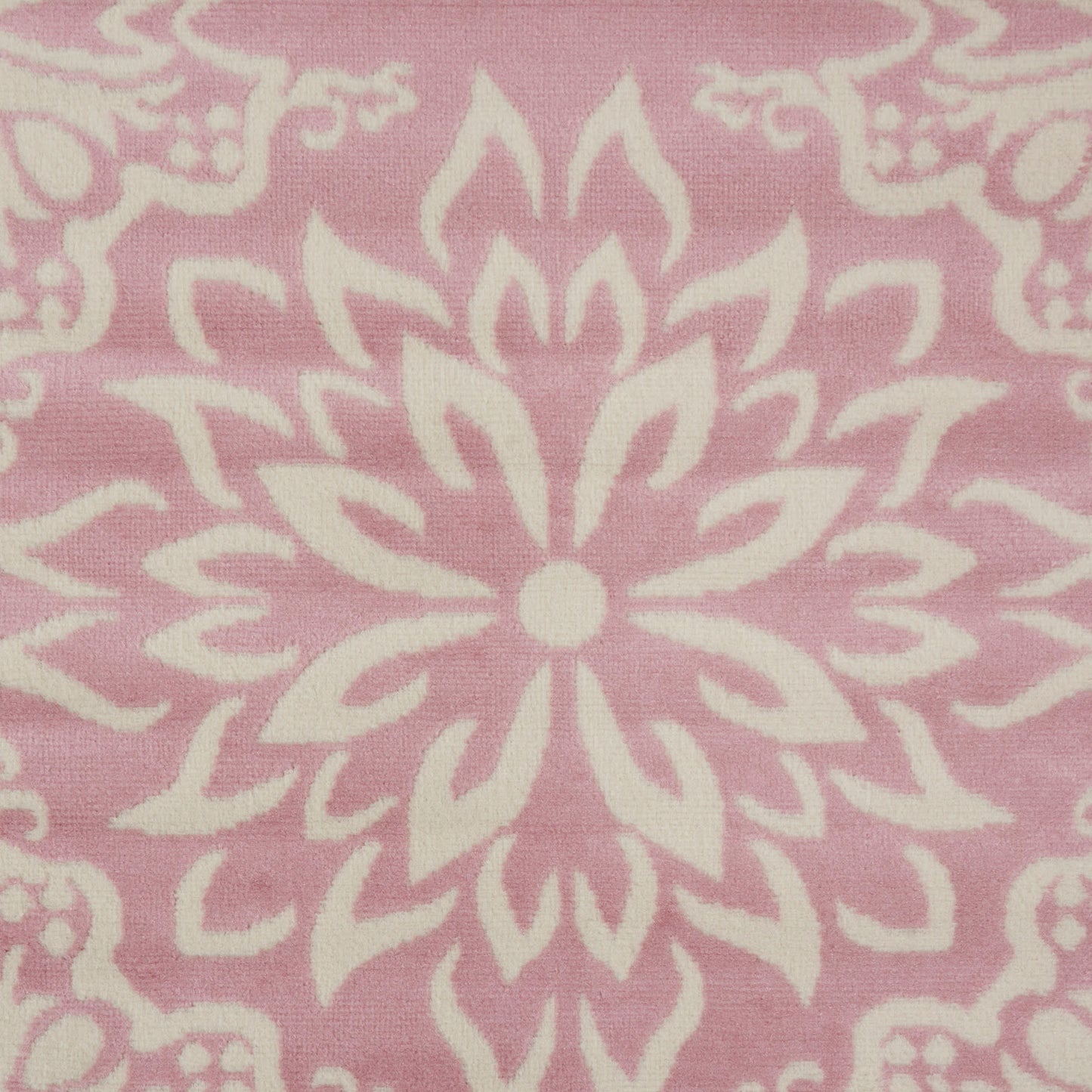 Pink rug featuring a white mandala floral pattern with a central starburst motif; farmhouse boho style, 8' x 10'.