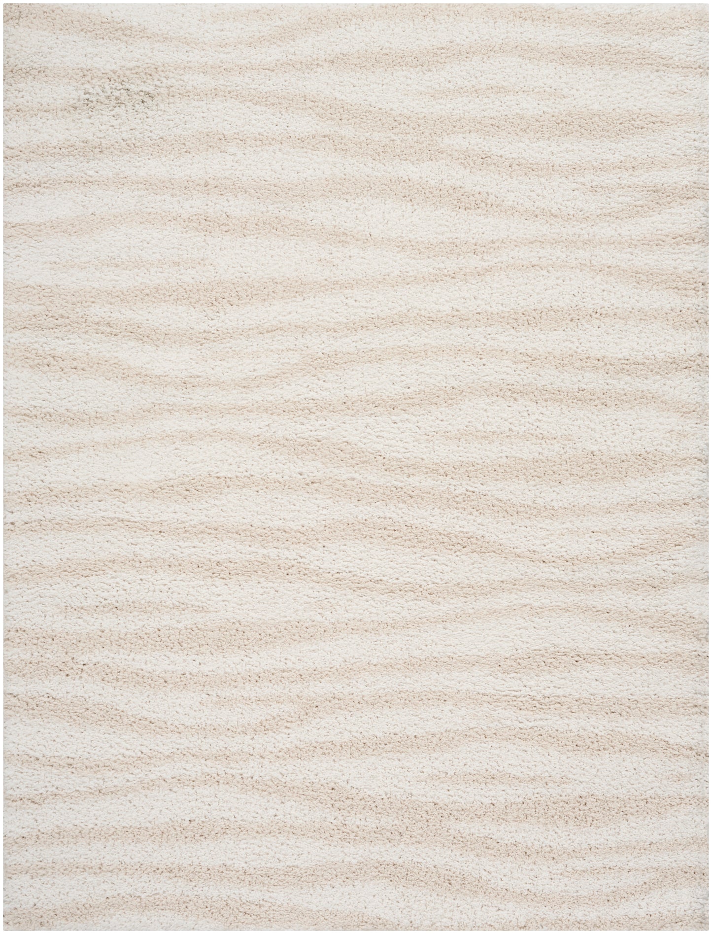 Cream beige shag rug with soft, thick pile and subtle wavy texture.