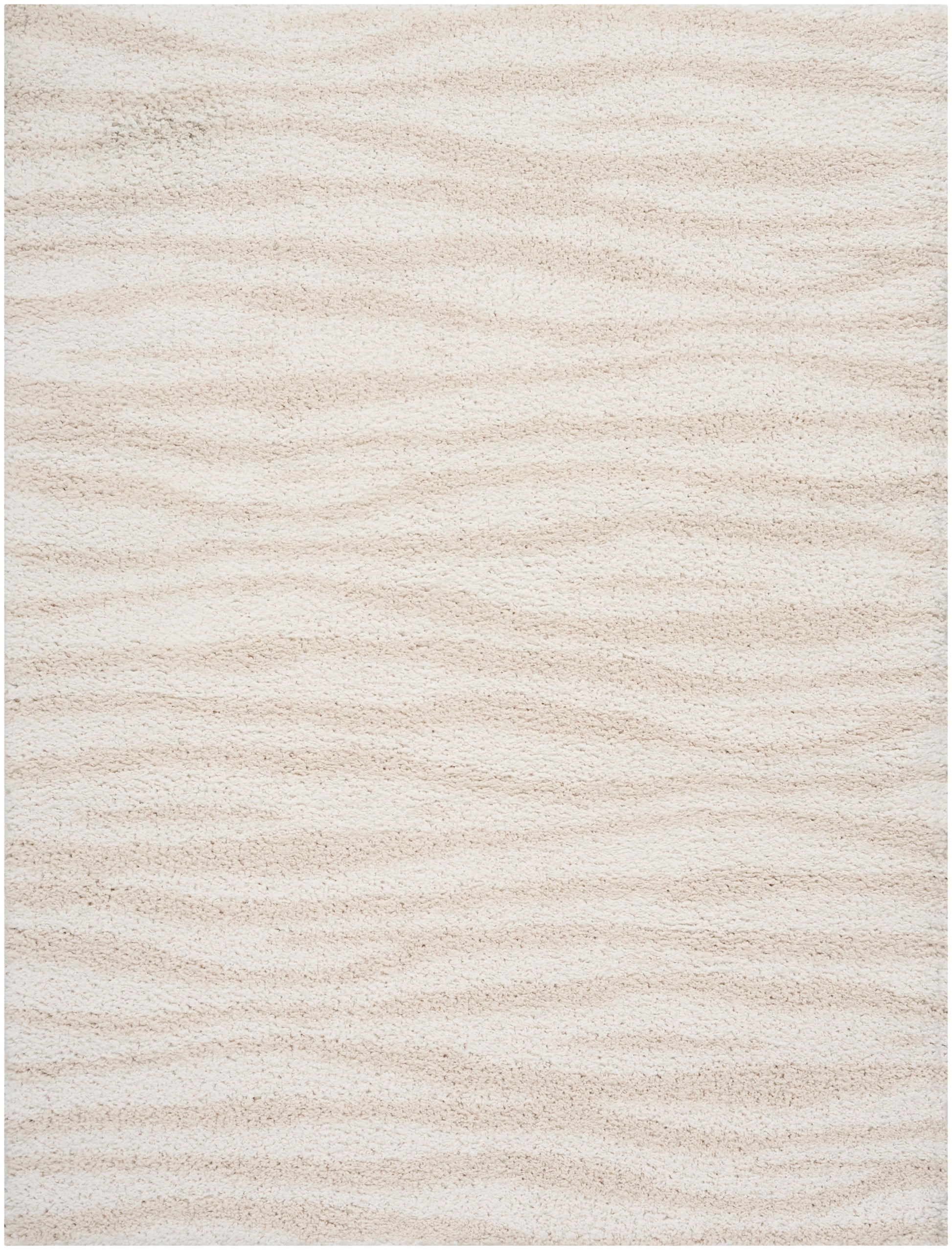 Cream beige shag rug with soft, thick pile and subtle wavy texture.