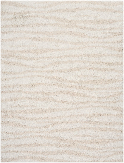 Cream beige shag rug with soft, thick pile and subtle wavy texture.