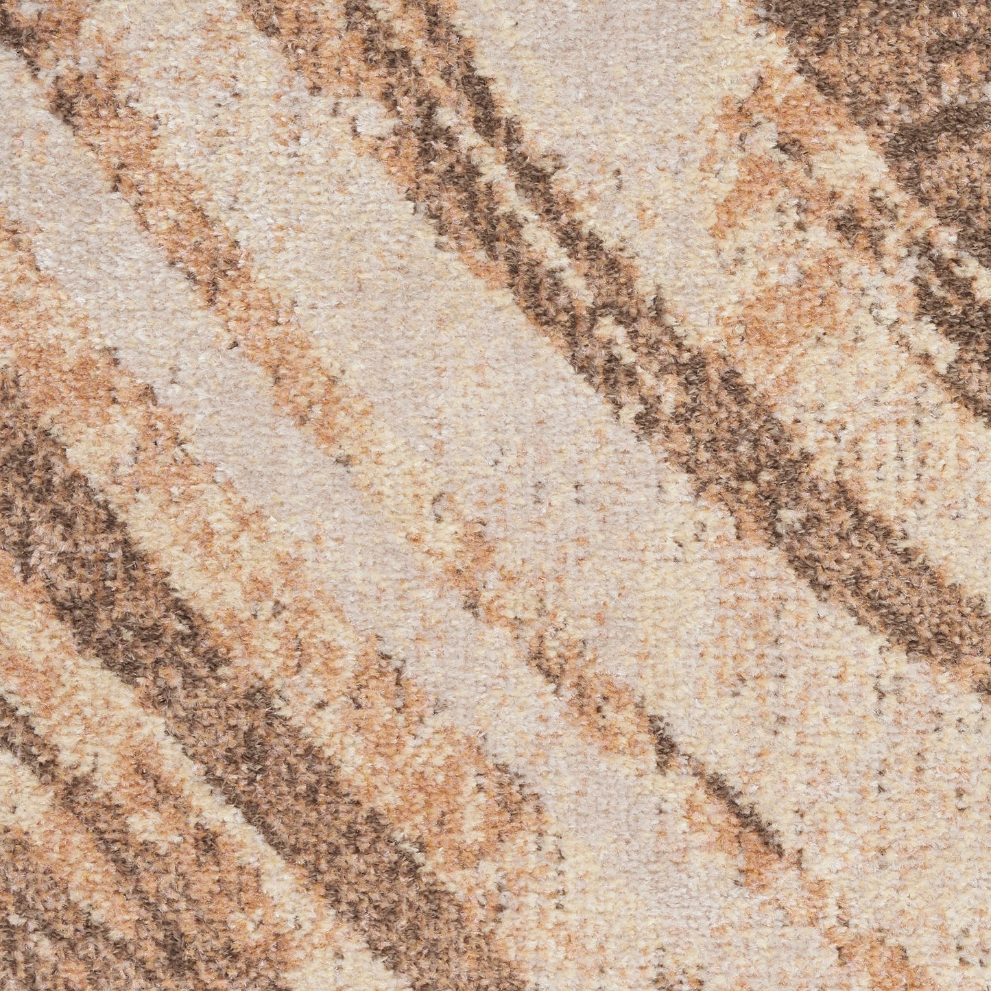 Close-up of a beige woven rug with diagonal tan-brown stripes and a textured rustic finish.