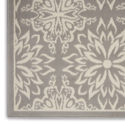 Gray woven rug with ivory damask floral pattern and pale gray border
