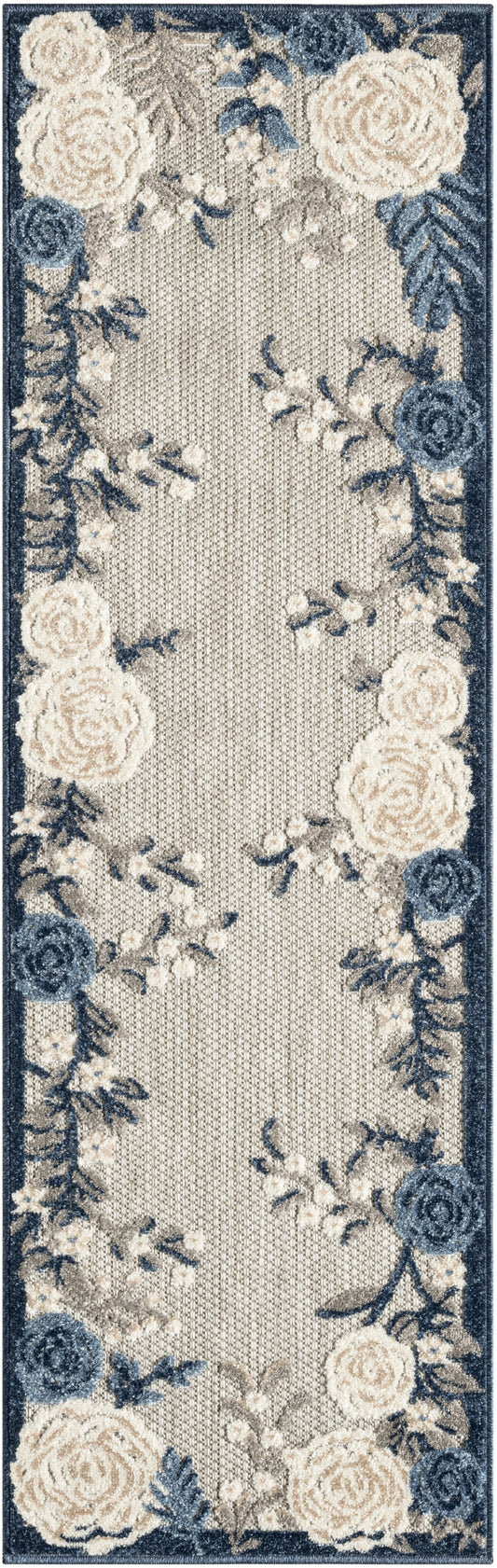 Long floral rug runner in cream and navy with a dark blue border featuring cream and blue roses; woven textured center.