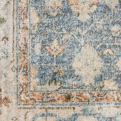 Blue and cream oriental rug with floral pattern and tan border; distressed pile texture