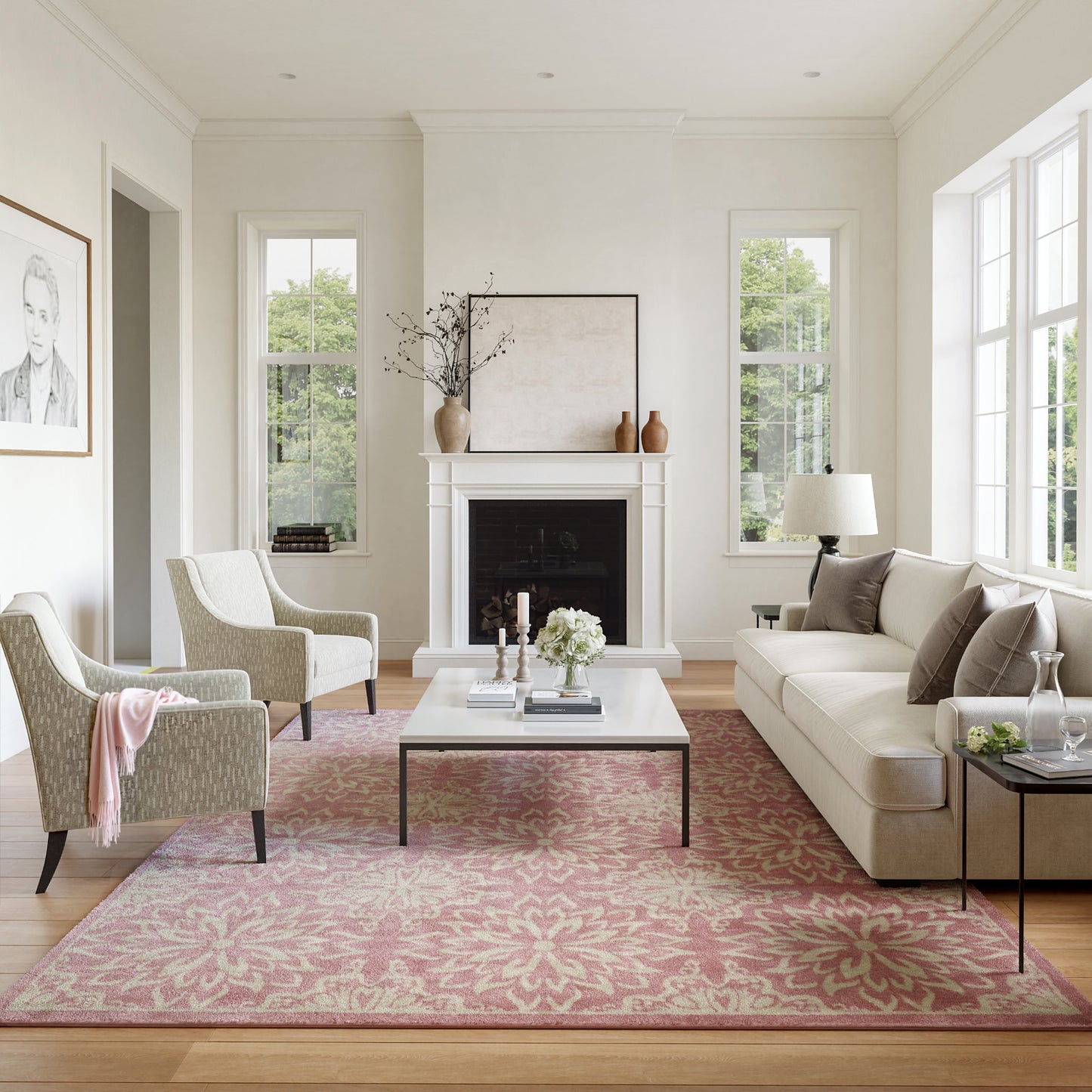 Bright modern classic living room with cream sofa, two pale green patterned armchairs, white coffee table, pink floral rug, fireplace.