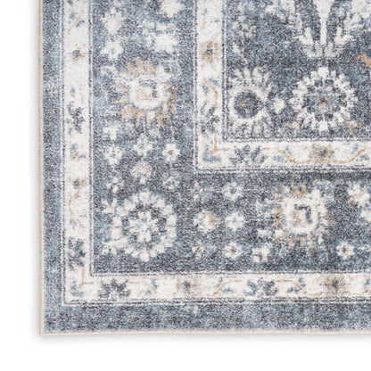 Blue and ivory distressed oriental runner rug with floral medallions and decorative border.
