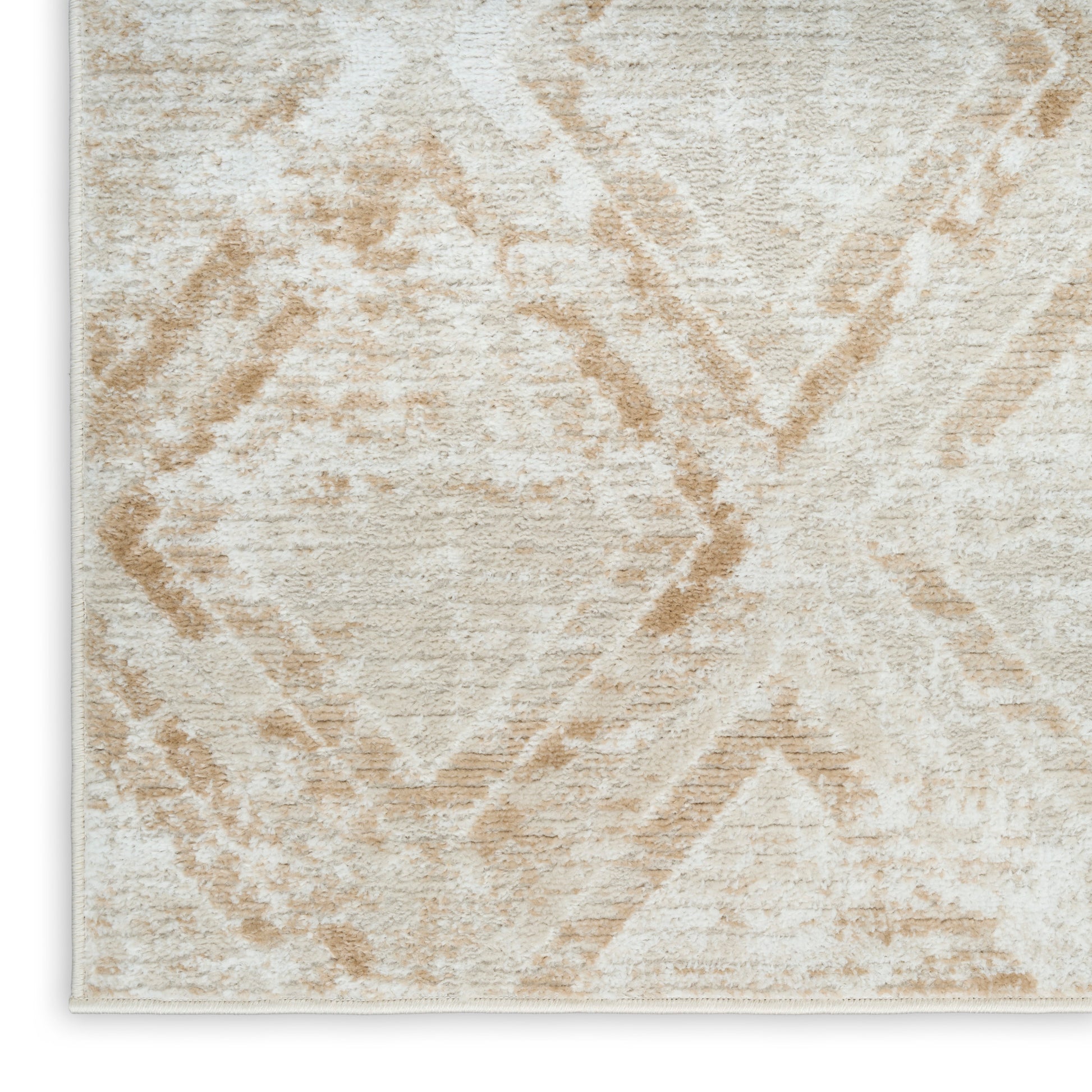 Beige geometric rug with cream & tan diamond pattern and soft plush texture.