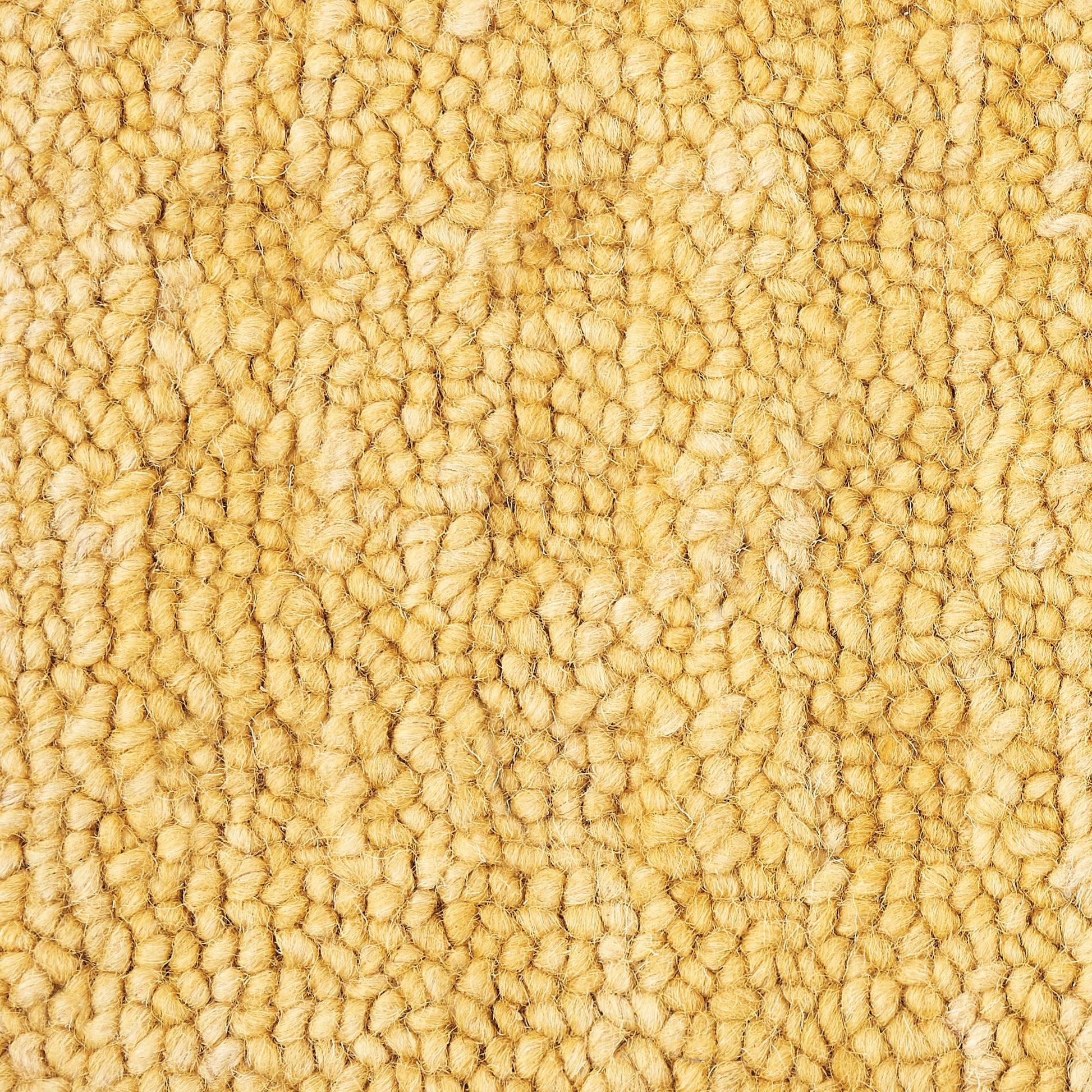 Warm beige textured looped-pile carpet close-up with dense plush fibers.