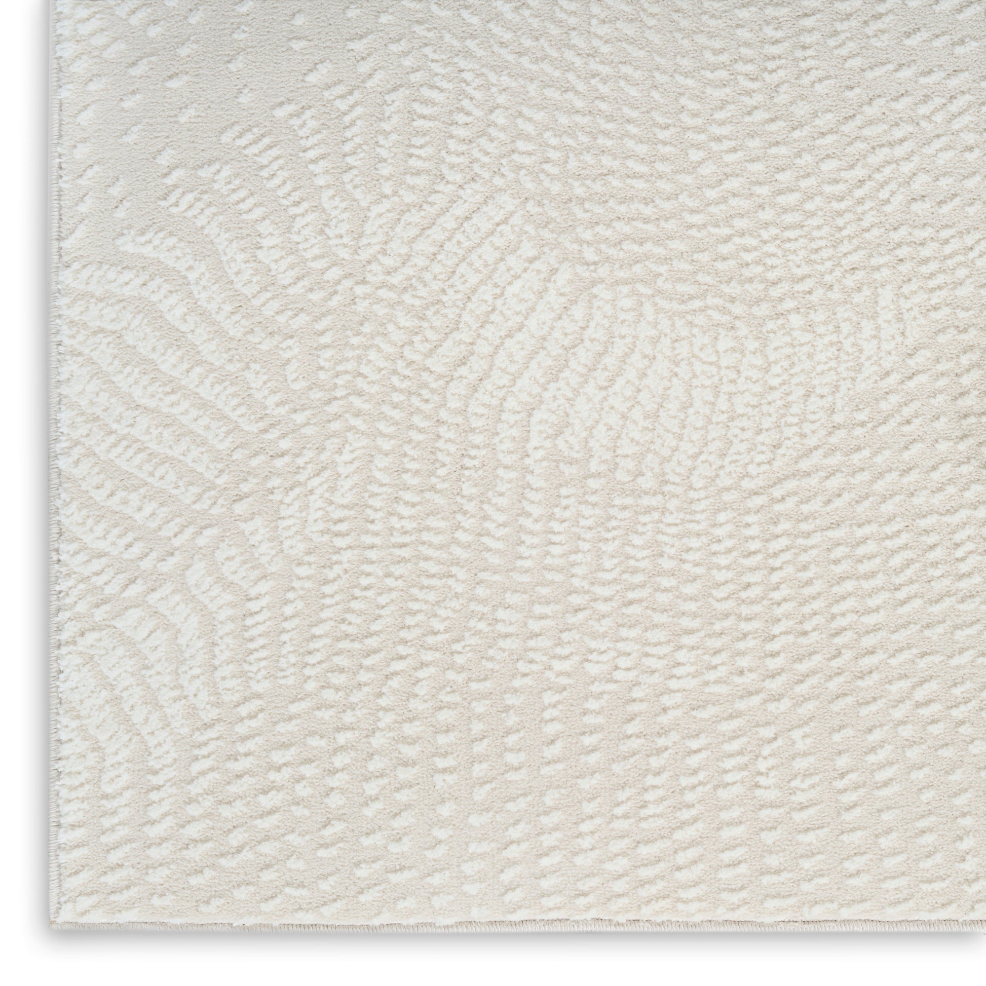 Cream textured area rug with a soft swirl pattern and plush pile for cozy, modern living spaces.