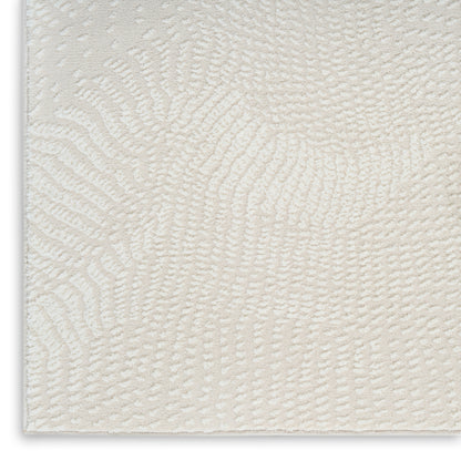 Cream textured area rug with a soft swirl pattern and plush pile for cozy, modern living spaces.