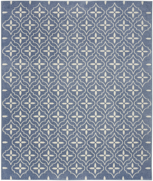 Blue rug with white repeating quatrefoil trellis pattern.