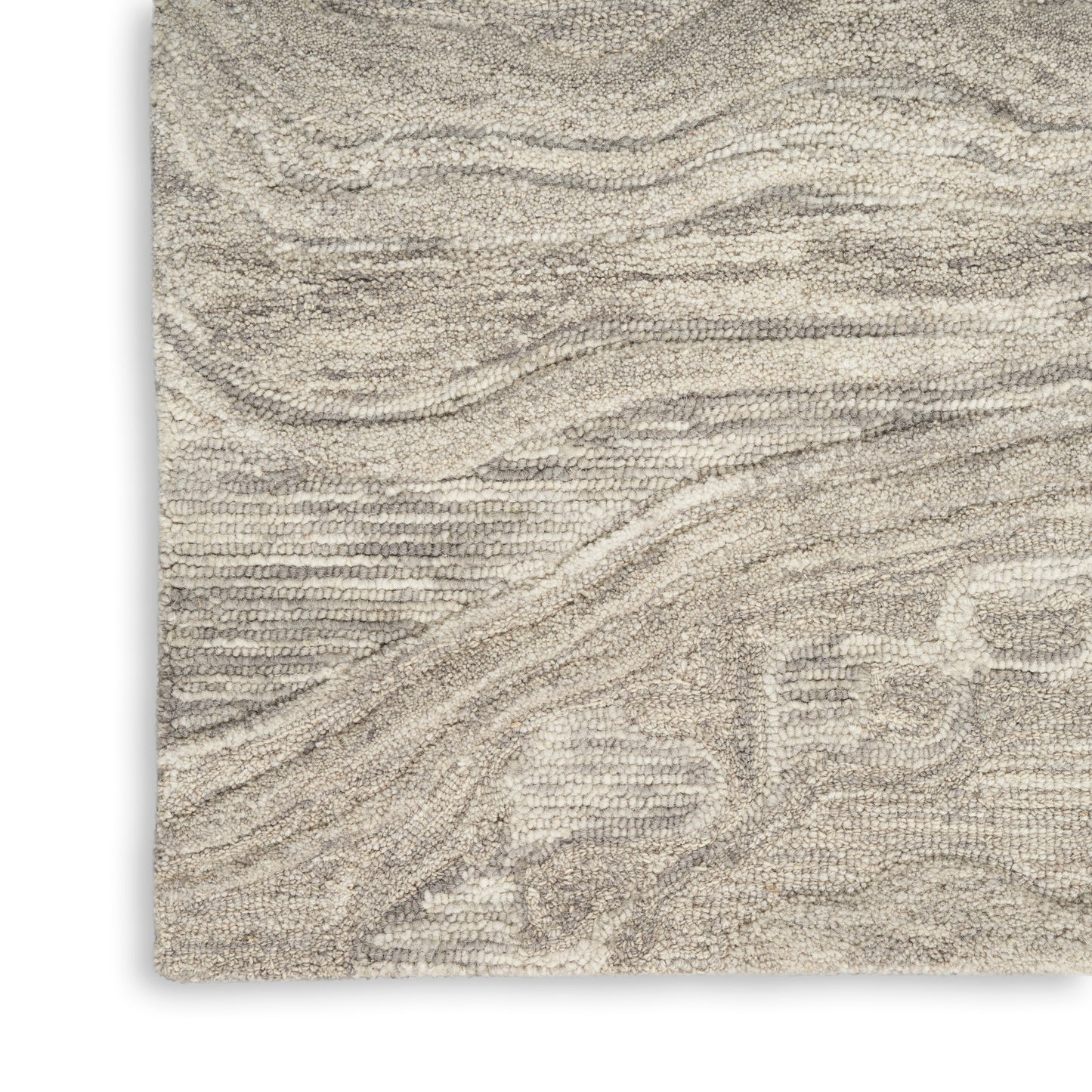Beige textured rug with cream wavy lines and subtle geometric pattern; plush, soft shag.