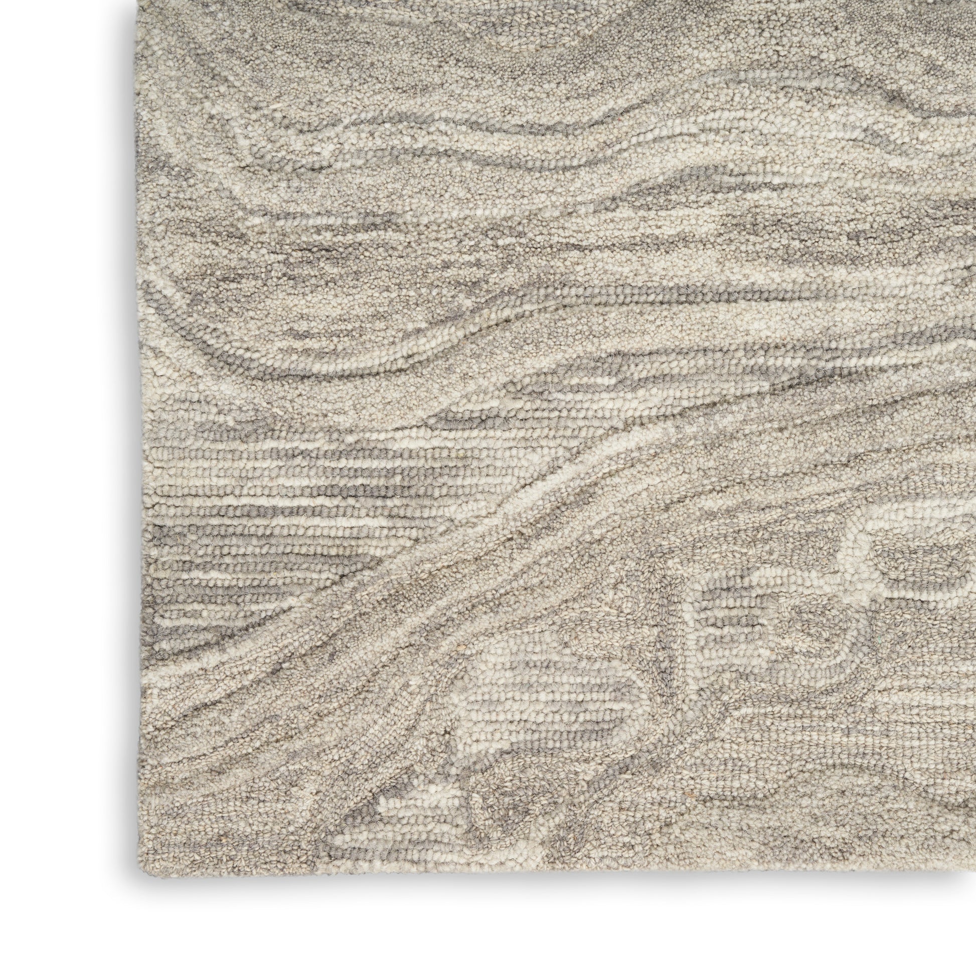 Beige textured rug with cream wavy lines and subtle geometric pattern; plush, soft shag.