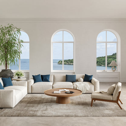 Coastal-inspired rug in cream and beige with blue accents; 10' x 14'.